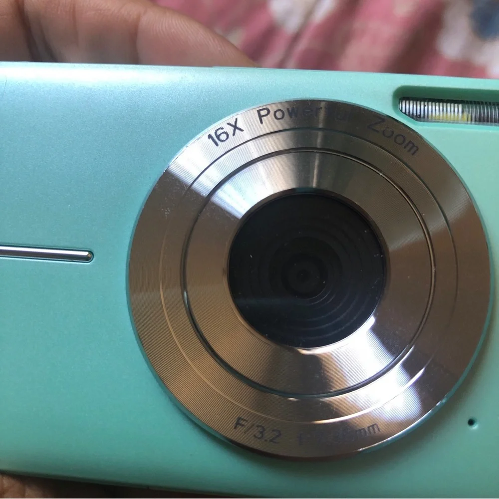 44.0 mega pixels 16x zoom turquoise camera